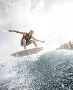 Young man surfing
